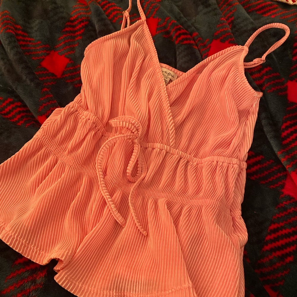 Pink blouse, size small. Adjustable straps. Clasp in front. Elastic in waist.